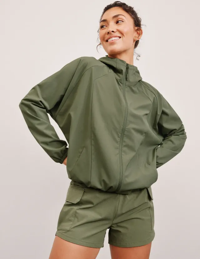 Beyond Yoga Cross Country Packable löparjacka Olive Branch